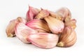 Some organic garlic cloves isolated on white background