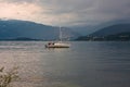 Some people on a sailboat in the lake