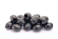 Some pitted black olives isolated on the white