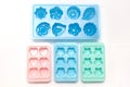 Some plastic ice cube mold trays of different colors Royalty Free Stock Photo