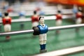 Some players on a Mini football game table in close up view