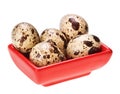 Some quail eggs in red square plate