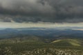 Some rays of sunshine slip between the storm clouds Royalty Free Stock Photo