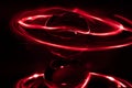 Some red rings surround a crystal clear glass ball on a mirror Royalty Free Stock Photo