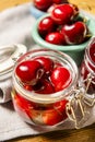 some ripe canned cherries in a clear