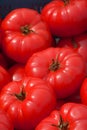 Some ripe and sweet tomatoes on outdoor market, big red beef Royalty Free Stock Photo