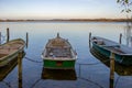 rowboats lie at a lake in the north of Germany in the morning in autumn Royalty Free Stock Photo