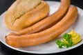 Some Sausages Frankfurter on a dark slate slab Royalty Free Stock Photo