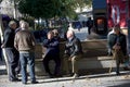 Some seniors sitting in the sun in Seville