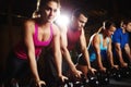 Some serious muscle training. A group of young men and women attending an exercise class. Royalty Free Stock Photo