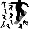 Some silhouettes of snowboarders Royalty Free Stock Photo