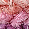 Some skeins of natural raffia of different colors on shelf. Natural material for knitting, crocheting, creative idea. Abstract diy Royalty Free Stock Photo