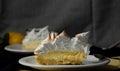 some slices of cake of lemon pie on white plates Royalty Free Stock Photo