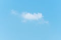 Some small white clouds floating in the blue sky Royalty Free Stock Photo