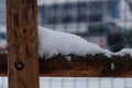 Some snow curdling on a wooden fence Royalty Free Stock Photo