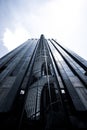 some stairs that go up to the top of a big black and blanck skyscraper