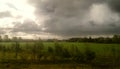 Some storm clouds above a meadow Royalty Free Stock Photo