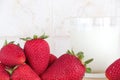 Some strawberries and a glass of milk