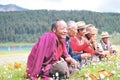 Some Tibetans chatting, sitting on the prairie Royalty Free Stock Photo