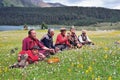 Some Tibetans chatting, sitting on the prairie Royalty Free Stock Photo