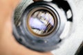 Some tiny screws seen on a loupe lens Royalty Free Stock Photo