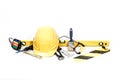 Some Tools For Handyman Like Helmet, Pliers, Saw, Hard Hat And Spirit Level Lying On The Ground
