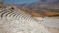 Some tourists visit the ruins of the ancient Greek theater of Se Royalty Free Stock Photo