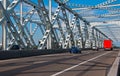 Some traffic over an old steel bridge Royalty Free Stock Photo