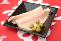 Some trout filets with green olives Royalty Free Stock Photo