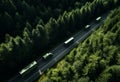 some trucks pass through a forest,