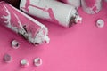 Some used pink aerosol spray cans and nozzles with paint drips lies on a blanket of soft and furry light pink fleece fabric. Class Royalty Free Stock Photo