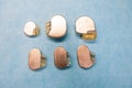Some various pacemakers and implantable defibrilators lie on a light blue base Royalty Free Stock Photo