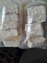 Some white tofu in a plastic bag