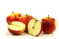 Some whole and some cut red and yellow apples Royalty Free Stock Photo