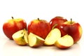 Some whole and some cut red and yellow apples Royalty Free Stock Photo