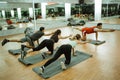 some women do muscle strength movements during floor exercises