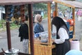 some women are shopping at a traditional market in Indonesia