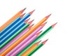 Some wood pencil crayons of different colors arranged in a wonderful line on a paper Royalty Free Stock Photo