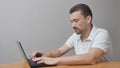Man working on the laptop and haveing a fault Royalty Free Stock Photo