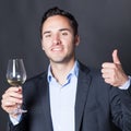 Somelier approving a glass of white wine Royalty Free Stock Photo