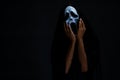 Someone in black cover with white ghost mask cosplay to devil ac Royalty Free Stock Photo