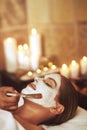 Someone busier than you is getting a facial right now. a young woman enjoying a facial treatment at the spa.