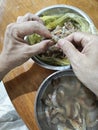 someone peeling raw fresh shrimp skin for its meat only. Royalty Free Stock Photo