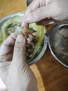 someone peeling raw fresh shrimp skin for its meat only. Royalty Free Stock Photo