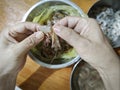 someone peeling raw fresh shrimp skin for its meat only. Royalty Free Stock Photo