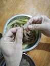 someone peeling raw fresh shrimp skin for its meat only. Royalty Free Stock Photo