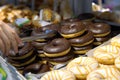 Someone takes a donut from a shelf in the confectionery department Royalty Free Stock Photo