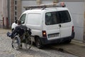 Someone in a wheelchair spared by a poorly parked car