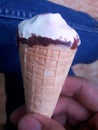 someone hand holding an ice cream