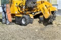 Stump grinder flinging wood chips